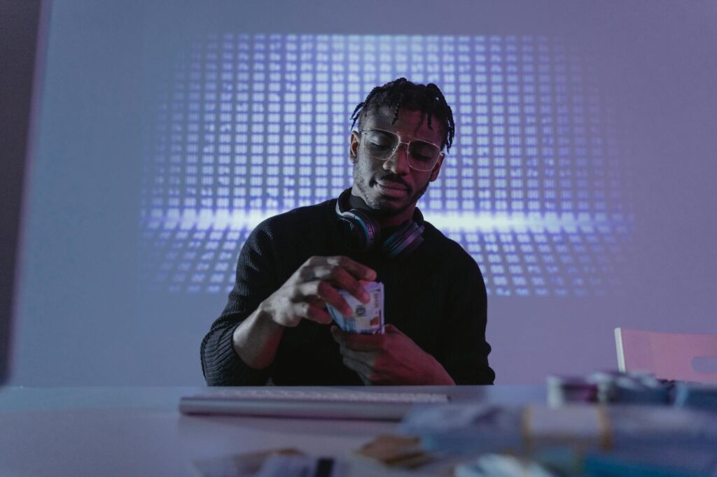 man on phone with computer infront of him